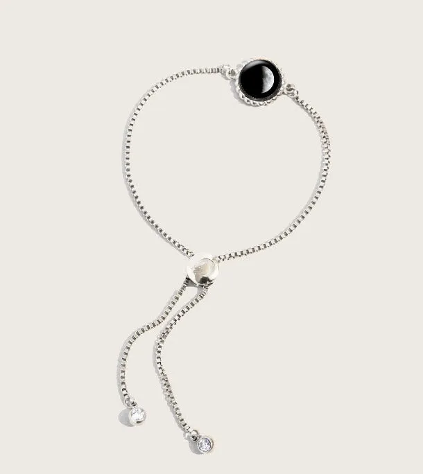 Celestial Elegance: Moonglow Carina Twist Bracelet in Stainless Steel