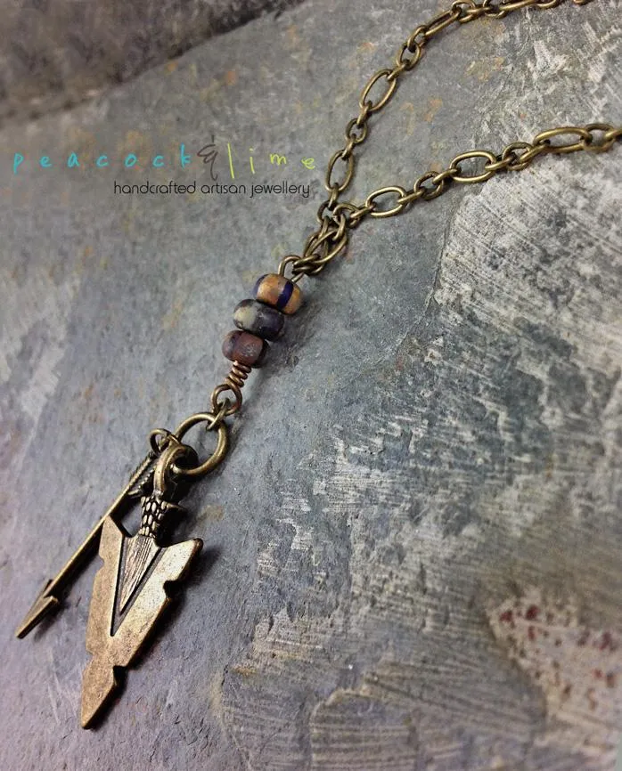 tribal arrowhead and arrow long brass necklace