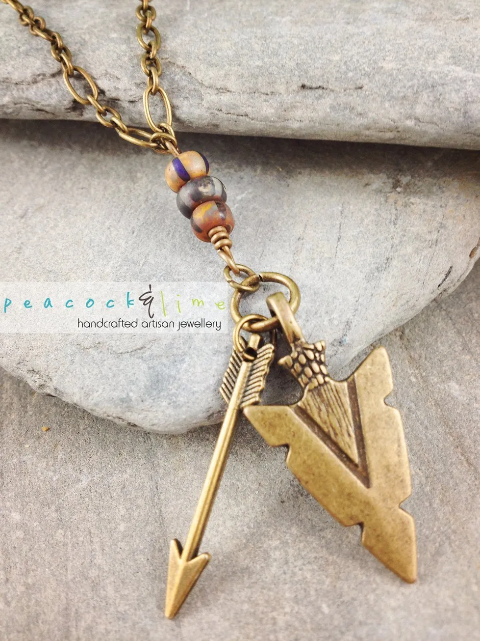 tribal arrowhead and arrow long brass necklace