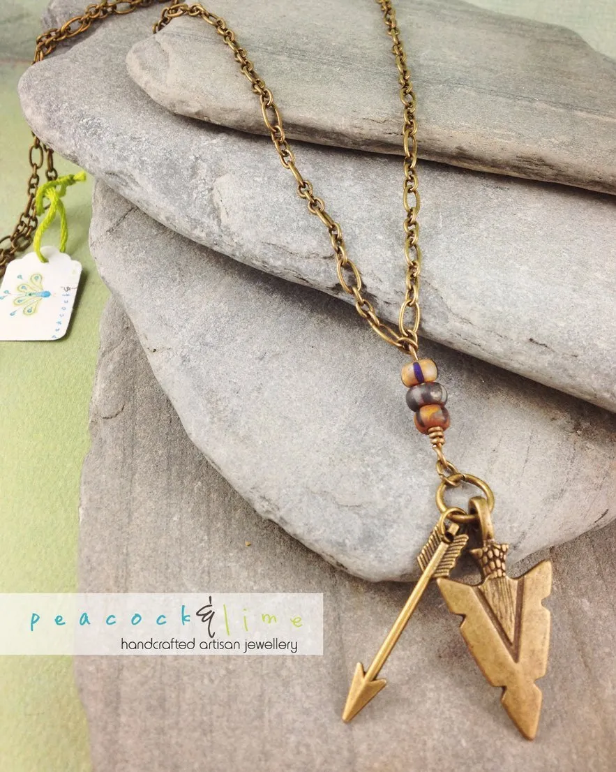 tribal arrowhead and arrow long brass necklace